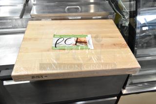 Brand new John Boos RA03 reversible maple cutting board, 24"x18"x2.25", hand grips, some scratches and dents, wrapped in plastic.