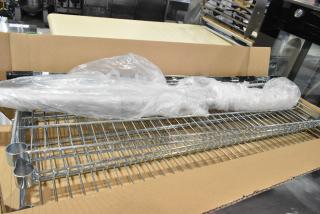 Box of Omar 21823 wire shelves, brand new with minor scratches and dents. Includes wrapped poles and chrome finish.