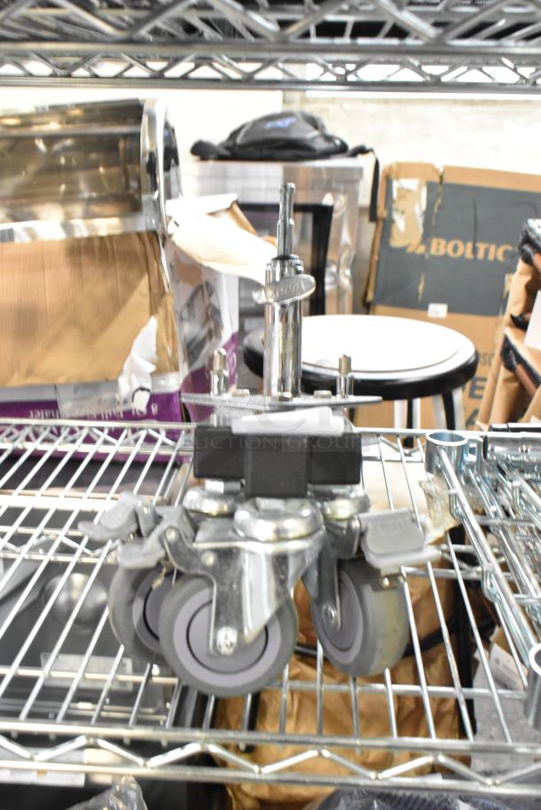 Kupo Commercial Casters, set of four, heavy-duty metal and rubber construction, in excellent condition, with locking mechanisms.