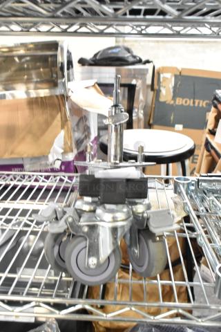 Kupo Commercial Casters, set of four, heavy-duty metal and rubber construction, in excellent condition, with locking mechanisms.