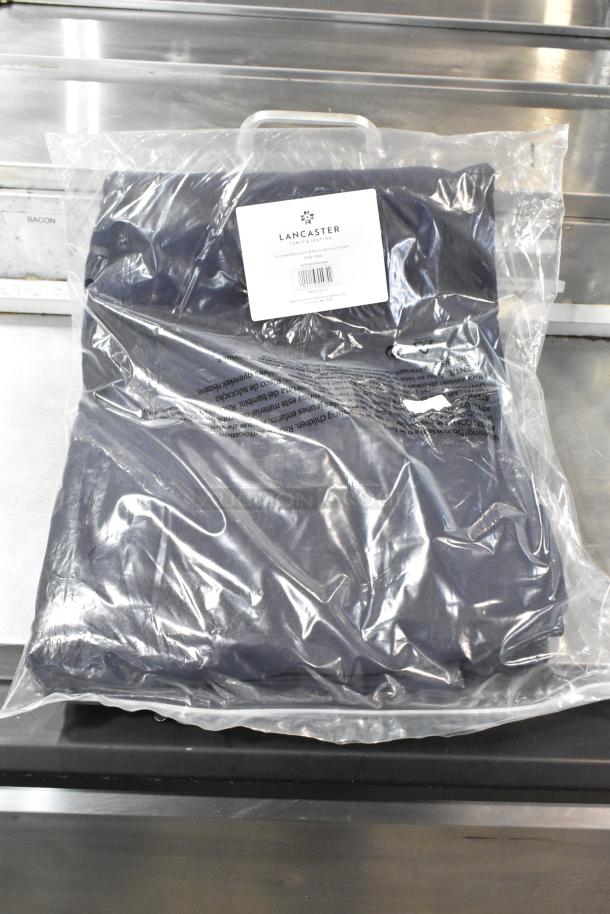 Brand new Lancaster Table & Seating 9' round midnight navy umbrella canopy in packaging, model 427UMCAR09NV.