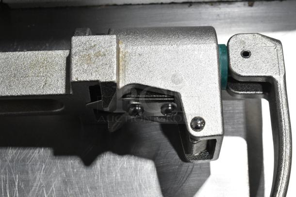 Brand new Garde 407 metal commercial can opener, scratch and dent condition, sturdy construction, close-up view.