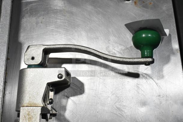 BRAND NEW SCRATCH AND DENT Garde 407 metal commercial can opener, silver tone, green handle, slight surface marks visible.
