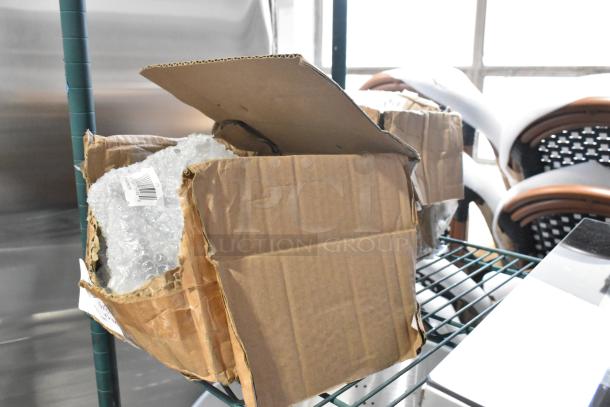 Lot of 8 brand new commercial casters, model 351302090155, in distressed boxes with protective bubble wrap visible.