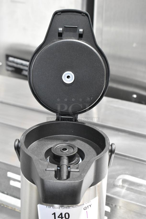 BRAND NEW Acopa Stainless Steel Air Pot, scratch and dent, open lid showing pump mechanism, item tag visible.