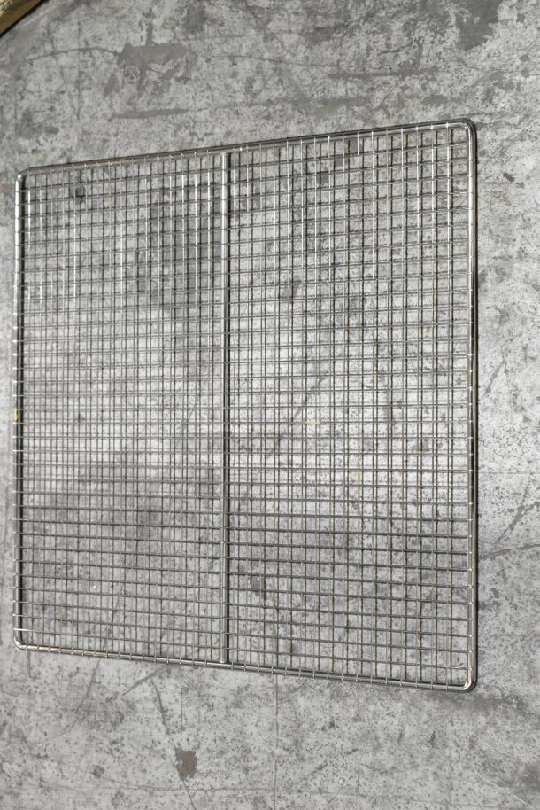 Four brand new metal racks with minor scratches and dents, grid design, durable steel construction, auction item.