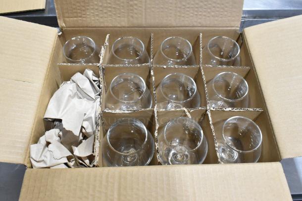 Open box with brand new Pasabahce Timeless Nick and Nora glasses and Acopa Select brandy snifters, in mint condition.