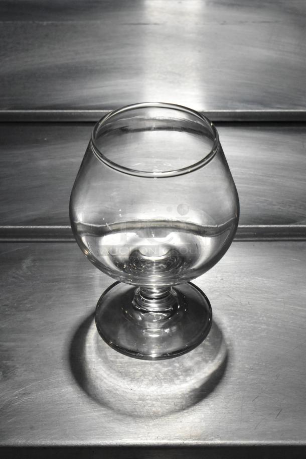 Brandy snifter glass, 9 oz., clear glass, bulbous shape, new condition, customizable.