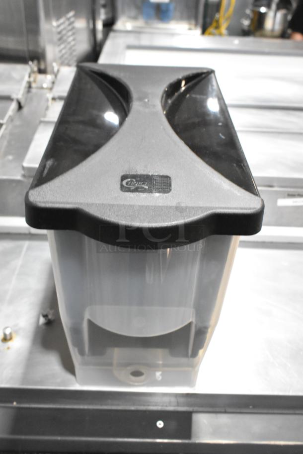 Black 3-gallon Choice Slim Beverage Dispenser, new condition, with manufacturer's logo on the lid.