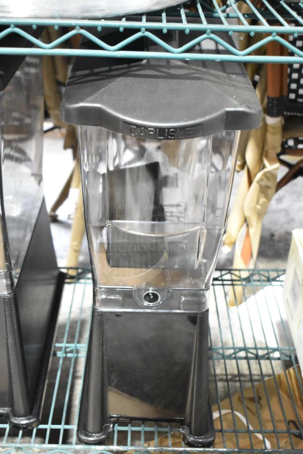3 Gallon Black Slim Beverage Dispenser, brand new, minor scratches, clear container with black base, labeled "Carlisle."