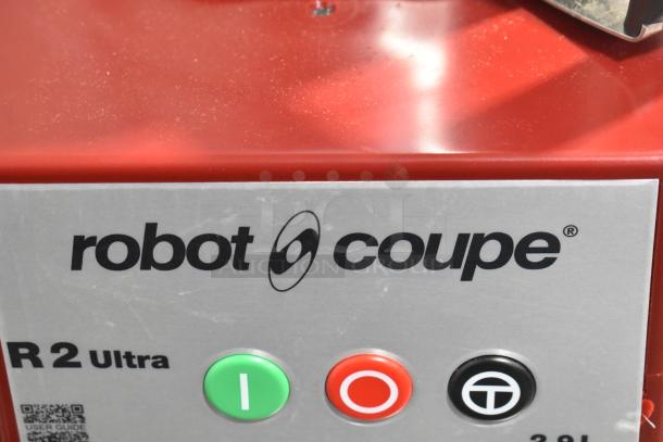 Robot Coupe R2UB food processor close-up showing control buttons and logo. Scratch and dent, 3 qt. capacity, stainless steel.