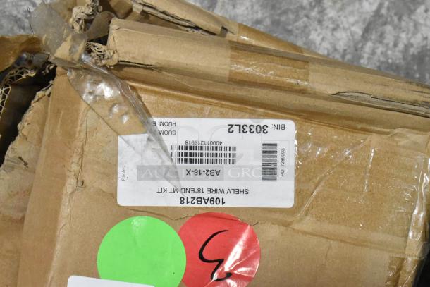 Damaged box of Advance Tabco AB2-18 end-mounted shelving system for 18" chrome wire shelves. Scratched, dented but new.
