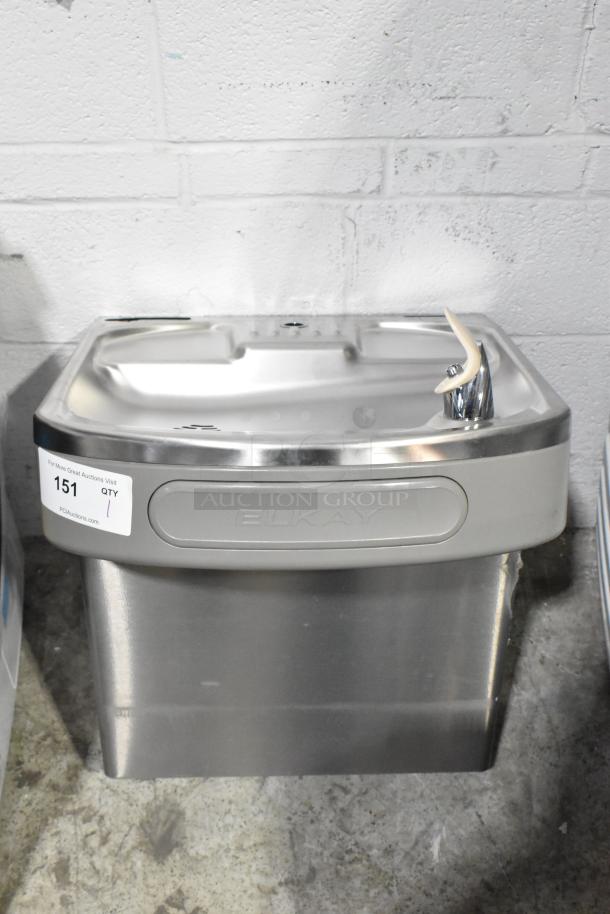 Brand new Elkay EZSDWS_1G stainless steel wall mount water fountain, 115V, 1 phase, scratch and dent condition, label visible.