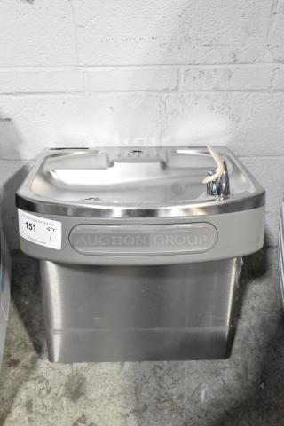 Brand new Elkay EZSDWS_1G stainless steel wall mount water fountain, 115V, 1 phase, scratch and dent condition, label visible.