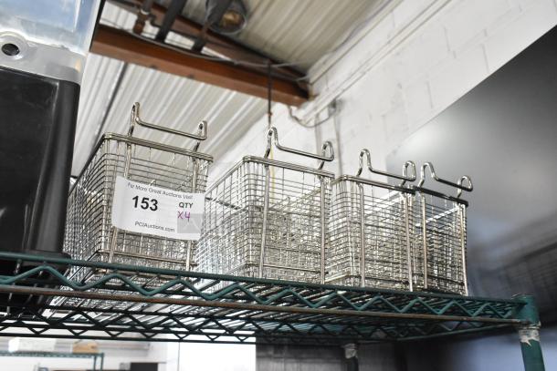 Four new scratch-and-dent metal fry baskets with handles, labeled "153, Qty x4," on a wire shelf.