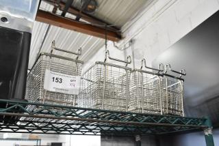 Four new scratch-and-dent metal fry baskets with handles, labeled "153, Qty x4," on a wire shelf.