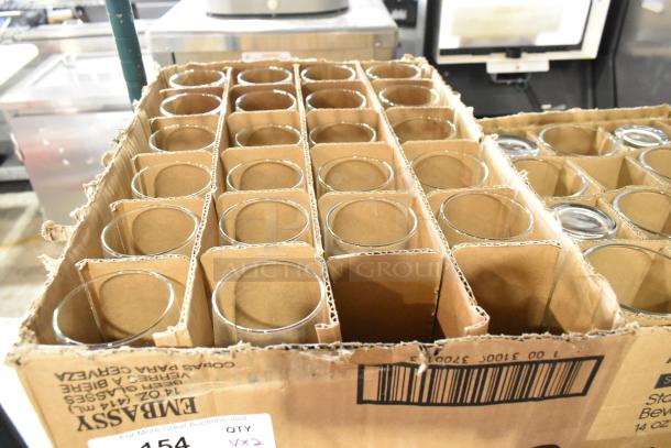 Box of brand new 14 oz. Libbey Embassy stemmed pilsner glasses in storage compartments, marked "scratch and dent."