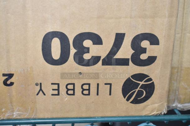 Cardboard box displaying the Libbey logo and numbers. Contains new glassware: Acopa Select stackable glass and Libbey pilsner glass.
