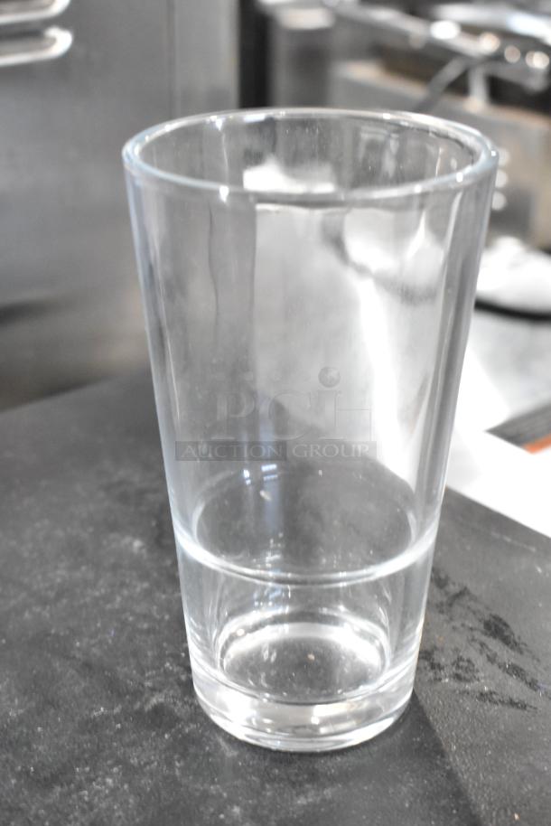 Acopa Select 14 oz. stackable glass, clear, new scratch and dent, ideal for beverages and mixing.