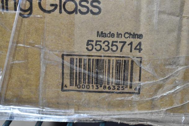 Cardboard box labeled "Made in China 5535714" containing new Acopa Select 14 oz. stackable beverage/mixing glass with barcode.