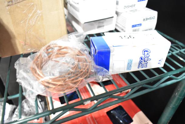 Brand new Avantco 970C032S filter drier with 1/4" sweat fitting and copper wire, boxed on shelf. Scratch and dent condition.