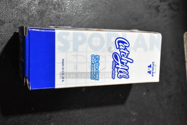 Box of Catch-All filter drier C-032-S by Sporan, featuring "It's the CORE that Counts!" slogan, made in the USA.