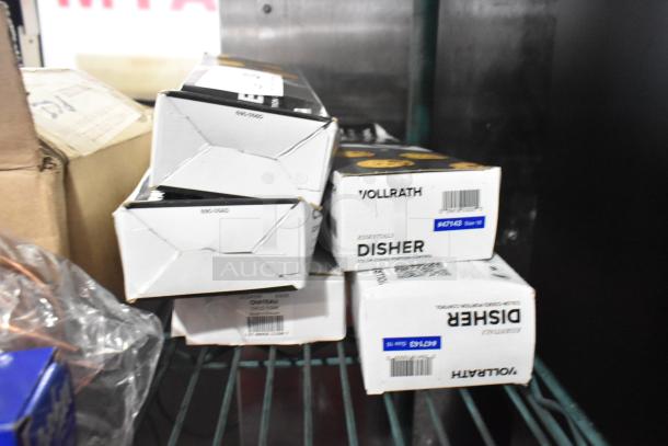 5 brand new scratch and dent Vollrath 47143 Jacob's Pride #16 blue thumb press disher boxes, 2 oz., on a shelf.