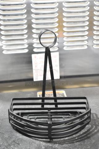 Brand new black metal countertop holder, minor scratches, semicircular design, durable construction, ideal for organizing.