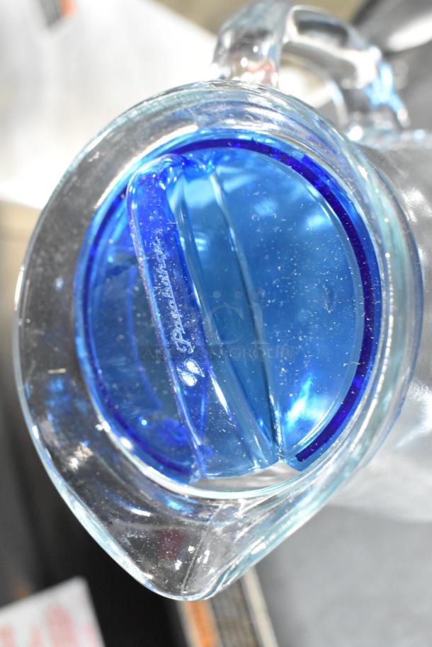 Pasabahce Bistro 61 oz. glass pitcher by Steelite, new with slight imperfections, clear with blue accents, visible branding.