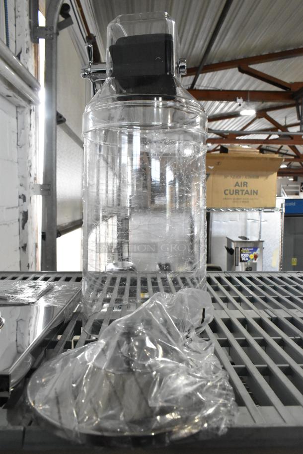 Brand new clear dispenser with minor scratches, in original packaging. Features a large cylindrical body, perfect for storage.