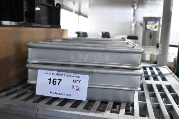 Brand new Baker’s Mark metal 3-loaf baking pans, scratch and dent condition, qty 2, marked for auction lot 167.