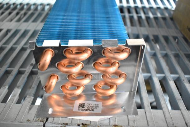 Brand new Avantco 17815282HC evaporator coil for A-12 units. Copper loops, minor scratches, model 17404050390 visible on tag.