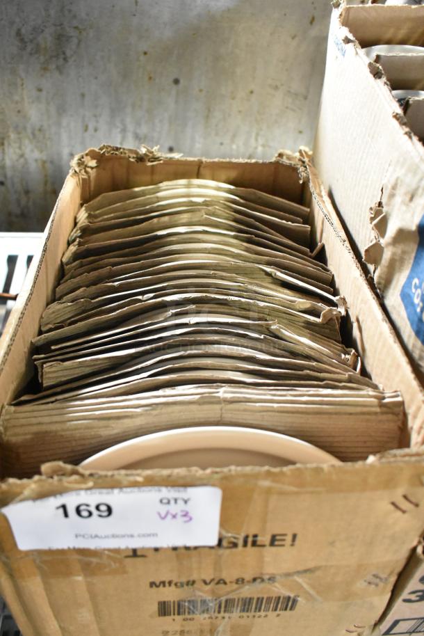 Box of new scratch and dent items: E0583 plates, Corona ramekin, Libbey margarita glass. Labeled "169 QTY Vx3".