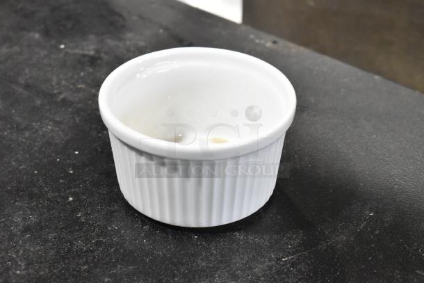 Bright white fluted porcelain ramekin with ribbed texture, PA1101707324 Actualite, by GET Enterprises. New condition.