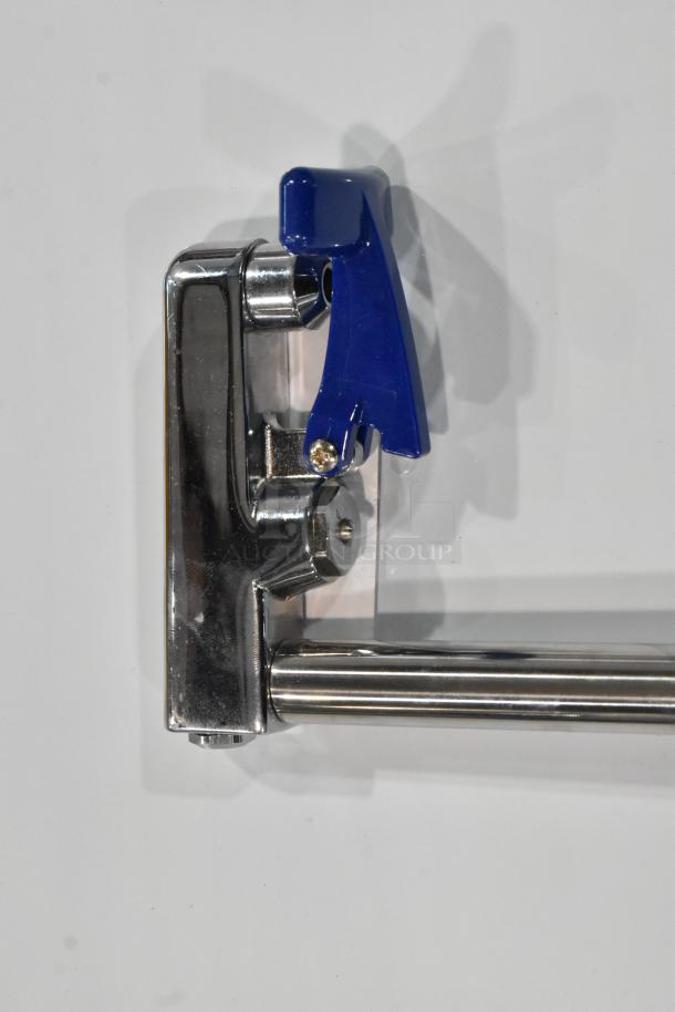 Brand new metal water faucet with visible blue lever. Scratch and dent condition. Stainless steel finish.