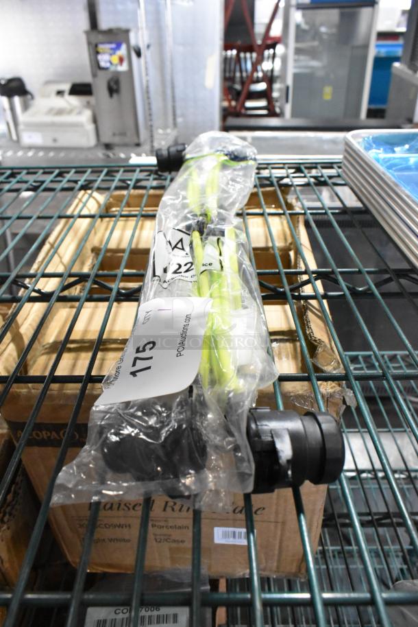 Brand new KT22 actuator device in packaging, labeled "175 PCI Auctions." Light yellow feature visible.