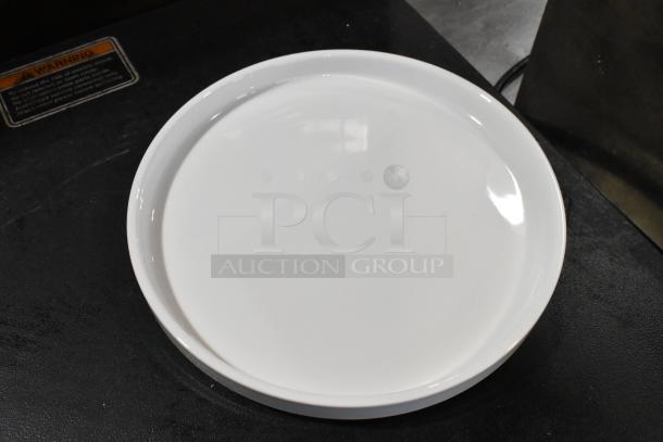 Acopa 9 1/4" Bright White Raised Rim Porcelain Plate, new with scratches and dents, glossy finish, model 303SCD9WH.