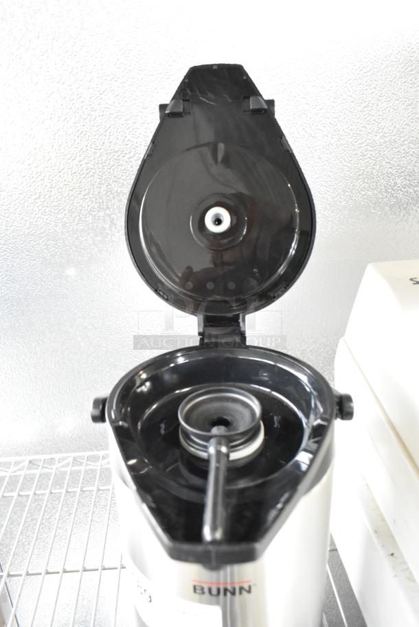 Bunn Stainless Steel Air Pot with open lid, black plastic interior, visible logo, in good condition.