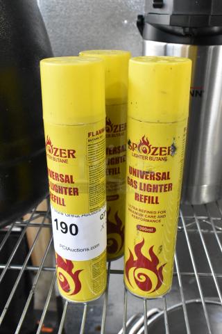 Three Spozer Universal Gas Lighter Refill cans, 300ml each, yellow with flame design, for lighter butane refills.