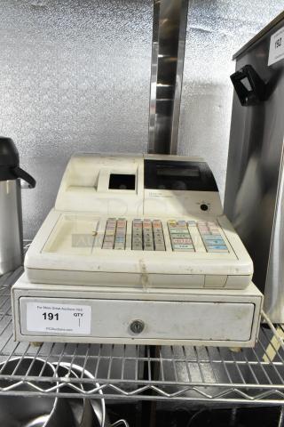 Sam4S ER-521SM electronic cash register, cream-colored, keypad visible, used condition, label indicating model.