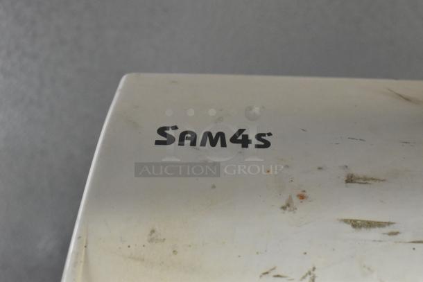 Sam4S ER-521SM electronic cash register, visible wear and markings on the surface, brand name shown on top.