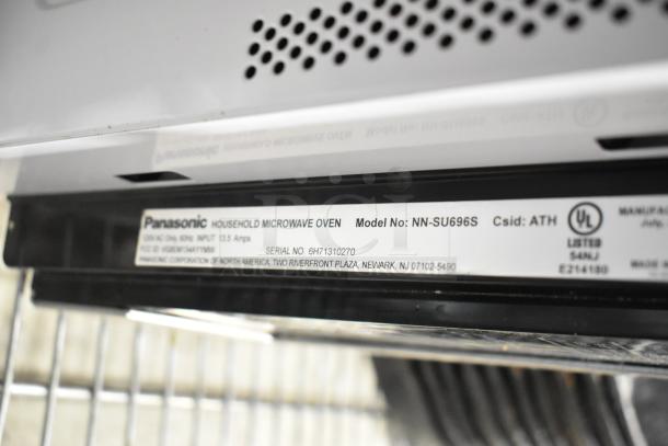 Panasonic NN-SU696S Countertop Microwave Oven with plate, 115V, 1 phase. Features model label and UL listing.