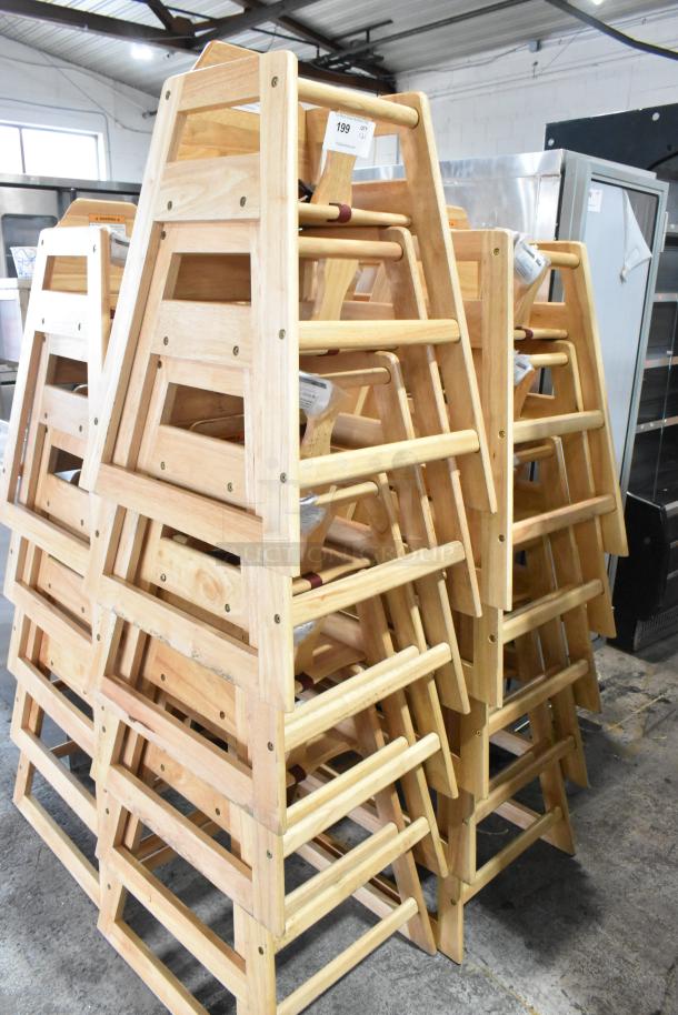 Stack of 21 wooden high chairs, natural finish, sturdy construction, auction lot number 199 visible.