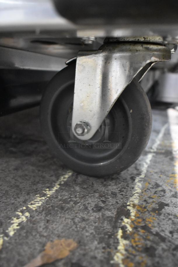 Mainstreet 541CHP1836I cabinet caster, showing robust commercial wheel design for easy mobility on rough surfaces.