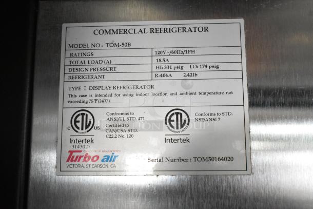 Turbo Air TOM-50B merchandiser label indicating model, ratings, refrigerant, and compliance with ANSI/UL and NSF/ANSI standards.