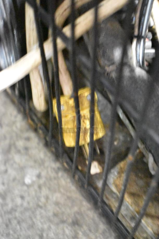 Blurred close-up of electrical components and wiring behind a Turbo Air TOM-50B merchandiser.