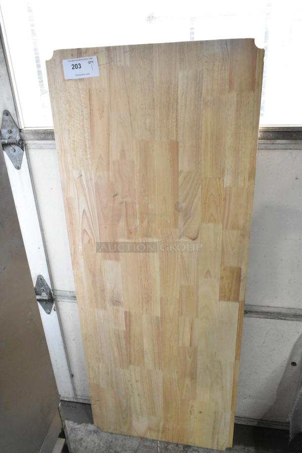 Wooden under shelf cover, light wood grain, rectangular shape, smooth finish, minor surface marks, auction tag labeled "203."