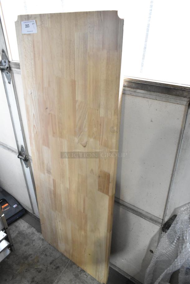 Wooden under shelf cover, light finish, rectangular shape, smooth surface, small corner cutouts, auction tag "203" visible.