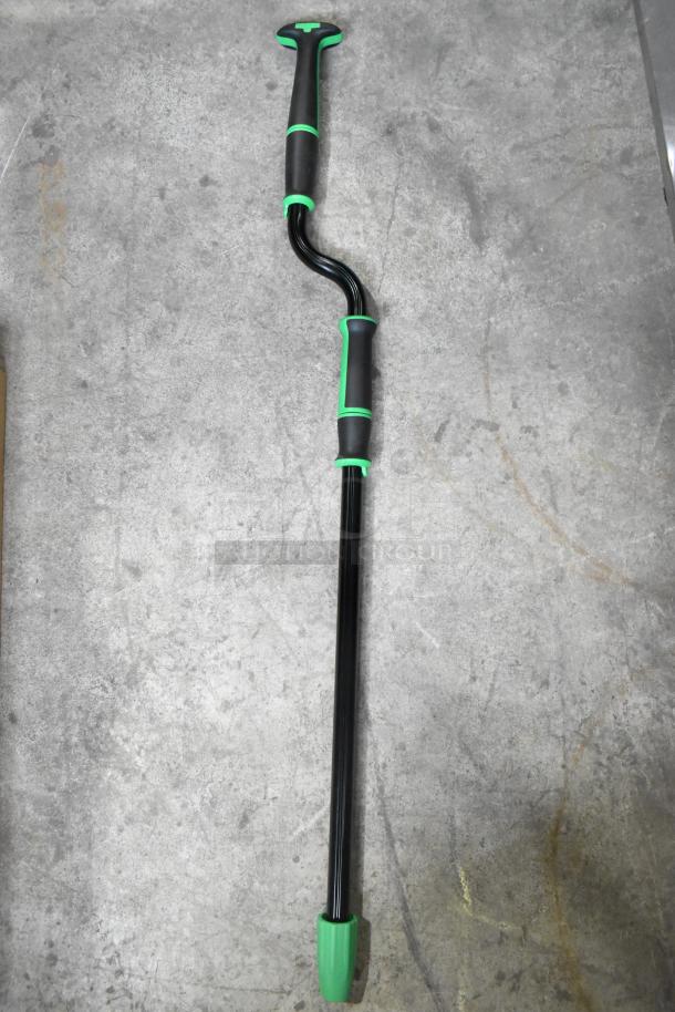 Pair of Unger walking sticks with ergonomic handles and green accents. Excellent condition, ideal for stability and support.
