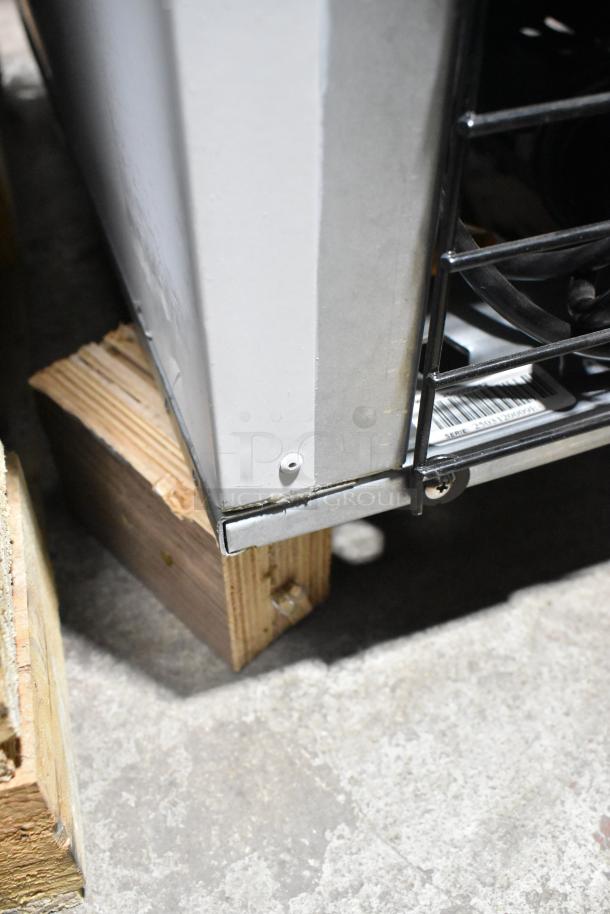 Accucold AFG26MLLH commercial cooler on casters, metal finish, poly-coated racks, model label visible, 115V, 1 phase.